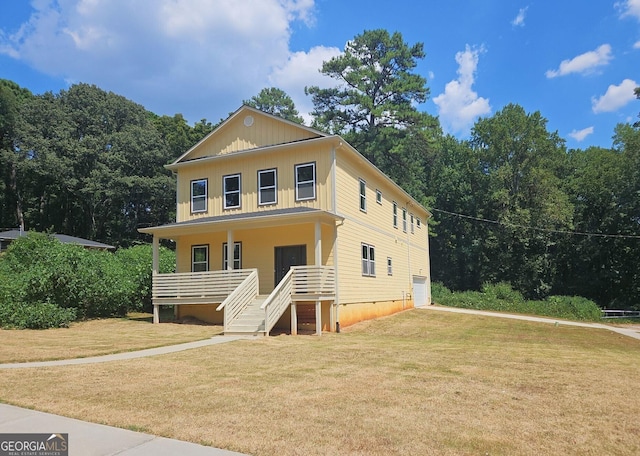 view of front of home with a front yard and a porch