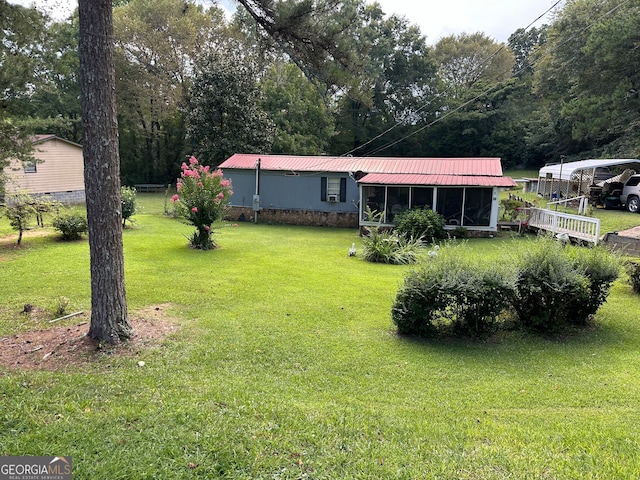 view of yard with a sunroom