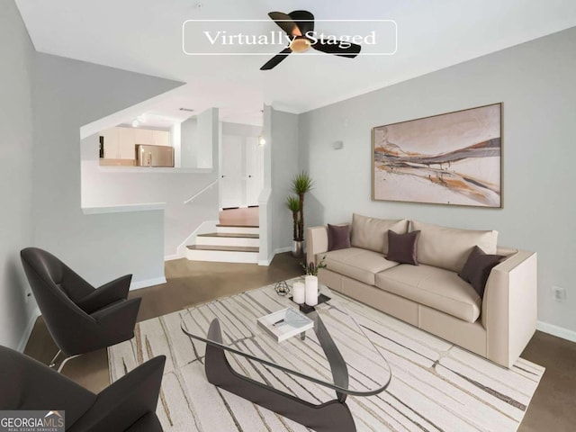 living area featuring baseboards, stairway, ceiling fan, and dark wood-type flooring