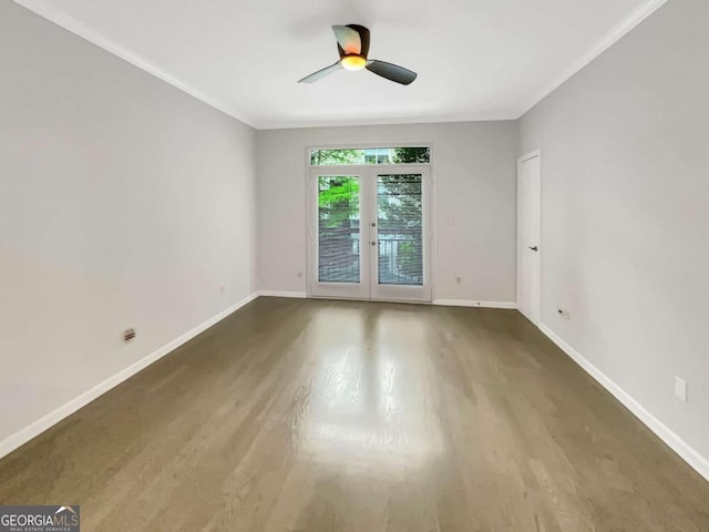 spare room featuring hardwood / wood-style floors, ornamental molding, french doors, and ceiling fan