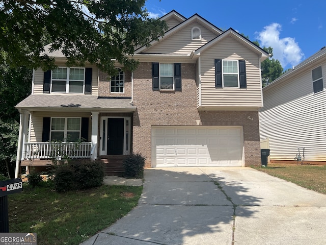 front facade featuring a porch and a garage