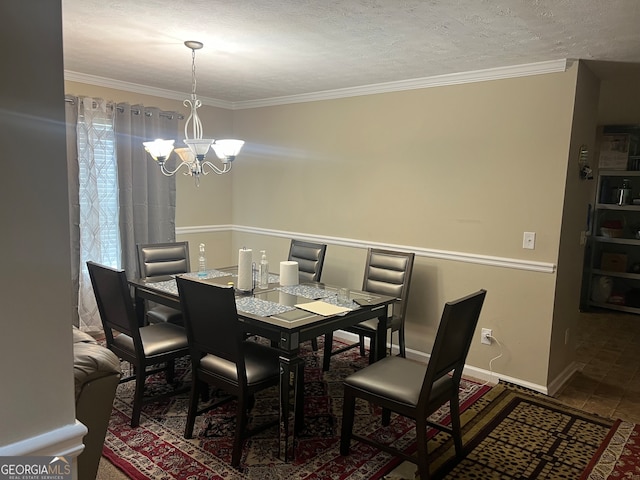 dining area featuring tile patterned floors, a notable chandelier, a textured ceiling, and ornamental molding