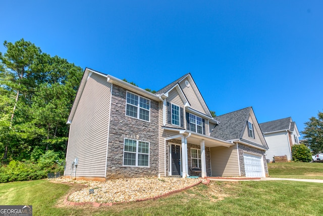 view of front of house featuring a garage and a front lawn