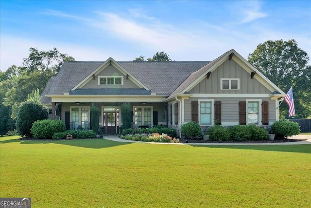 craftsman house with a front lawn