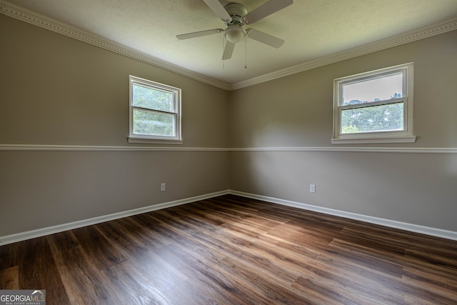 spare room featuring hardwood / wood-style flooring, ornamental molding, plenty of natural light, and ceiling fan