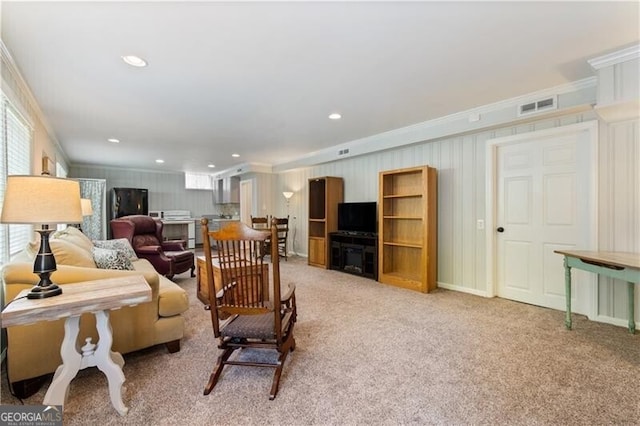 living room with crown molding and light carpet