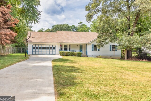 ranch-style house with a front yard and a garage