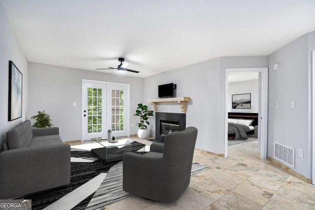 tiled living room with ceiling fan