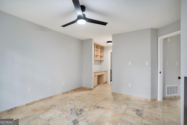 unfurnished bedroom featuring a spacious closet, a closet, ceiling fan, and light tile patterned floors