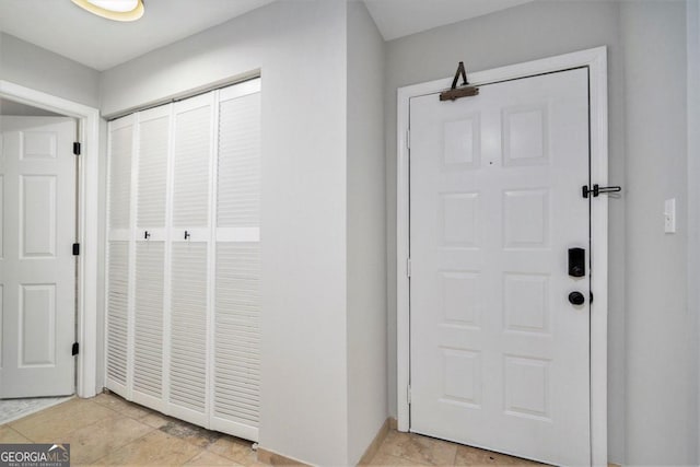 interior space with light tile patterned floors