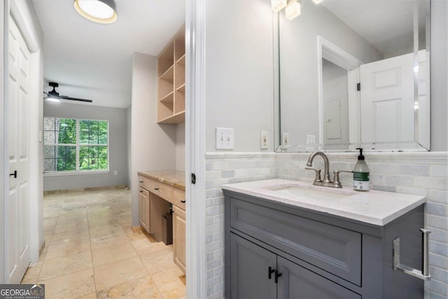 bathroom featuring ceiling fan, backsplash, tile patterned flooring, and vanity