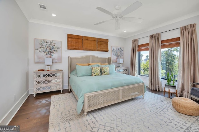 bedroom featuring visible vents, crown molding, baseboards, recessed lighting, and dark wood-style flooring