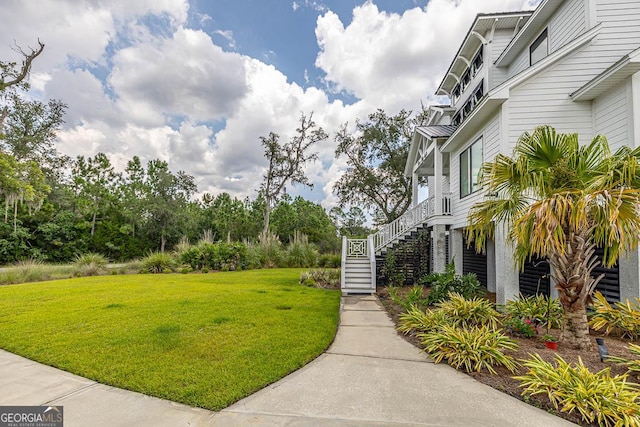 surrounding community with a lawn and stairs