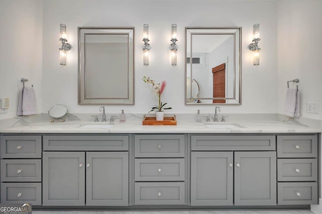 full bathroom featuring double vanity and a sink