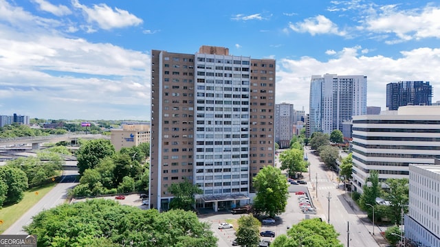 birds eye view of property with a view of city