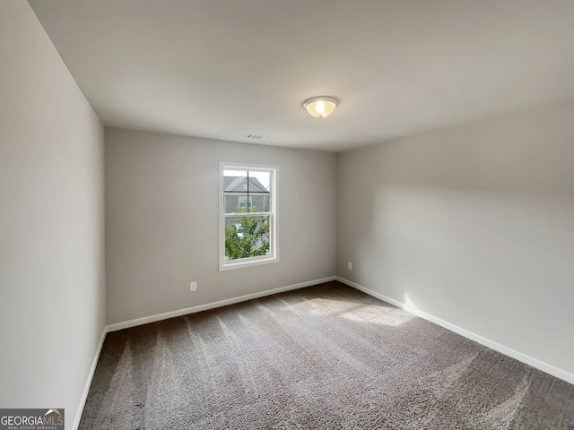 unfurnished room featuring carpet floors