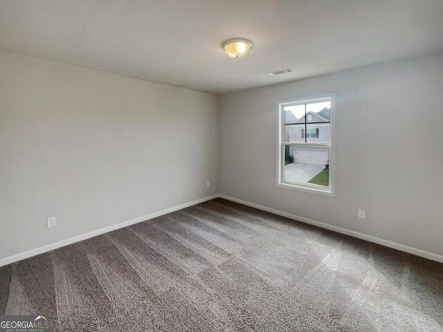 spare room featuring carpet flooring