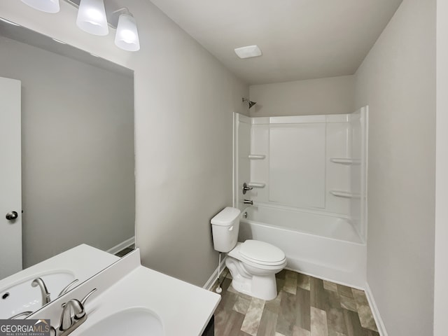 full bathroom featuring washtub / shower combination, wood-type flooring, toilet, and vanity