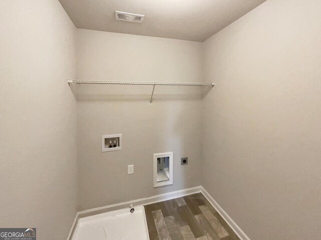 laundry room with hookup for an electric dryer, washer hookup, and hardwood / wood-style floors