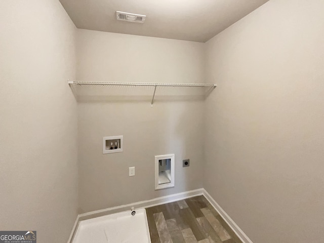 laundry room with hookup for a washing machine, laundry area, visible vents, dark wood-style floors, and electric dryer hookup