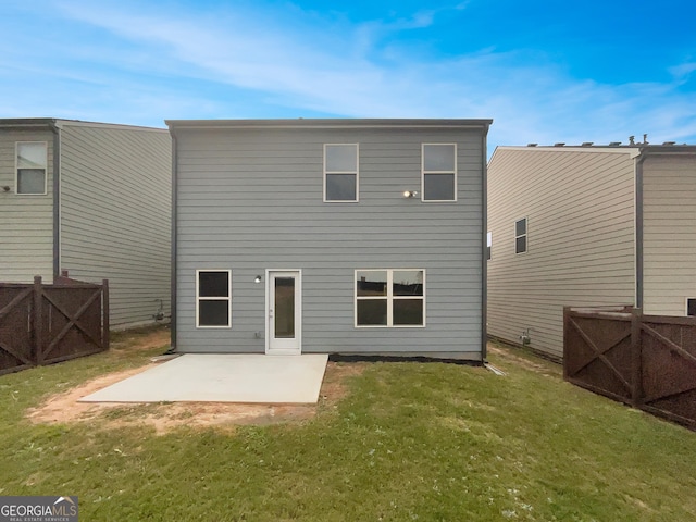 back of house featuring a patio area, fence, and a lawn