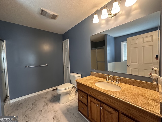 bathroom featuring toilet, a textured ceiling, tile patterned floors, and vanity