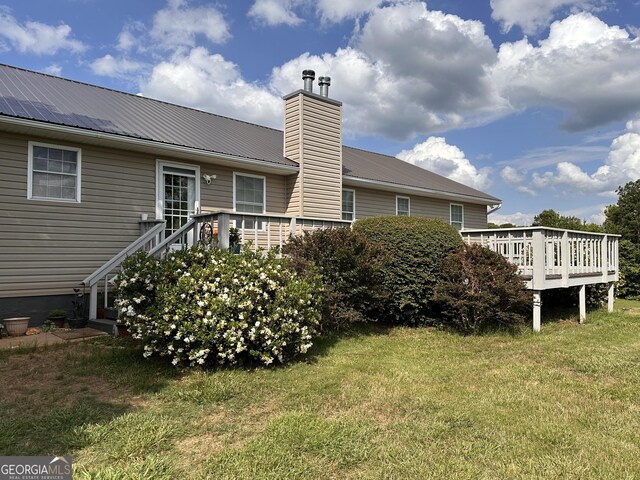 exterior space featuring a yard and a deck