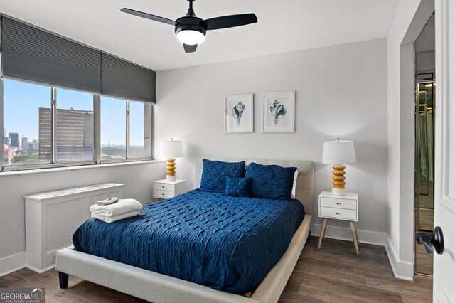 bedroom featuring hardwood / wood-style flooring and ceiling fan