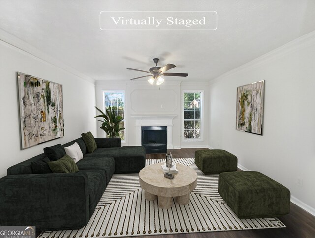 living room featuring a wealth of natural light, ornamental molding, hardwood / wood-style floors, and ceiling fan