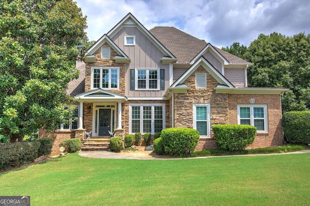 craftsman-style home with a front yard