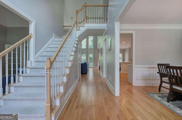 interior space featuring light hardwood / wood-style flooring and ornamental molding