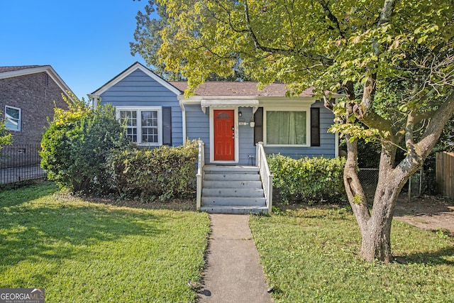 view of front of property with a front lawn