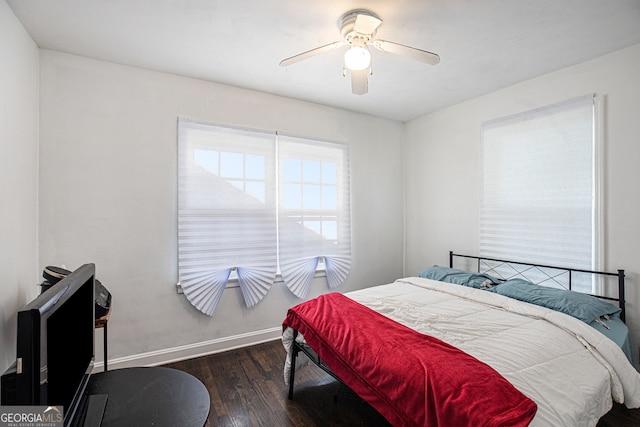 bedroom featuring ceiling fan and dark hardwood / wood-style flooring