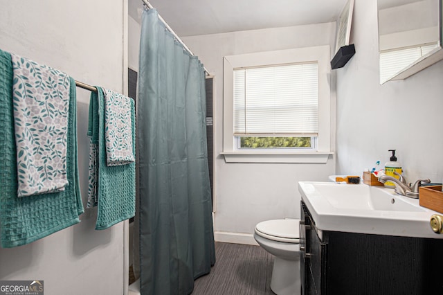 bathroom with vanity, toilet, and a shower with curtain