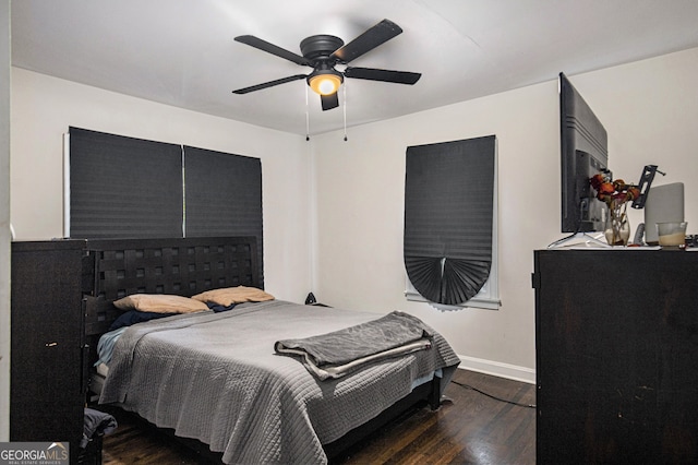 bedroom featuring dark hardwood / wood-style floors and ceiling fan