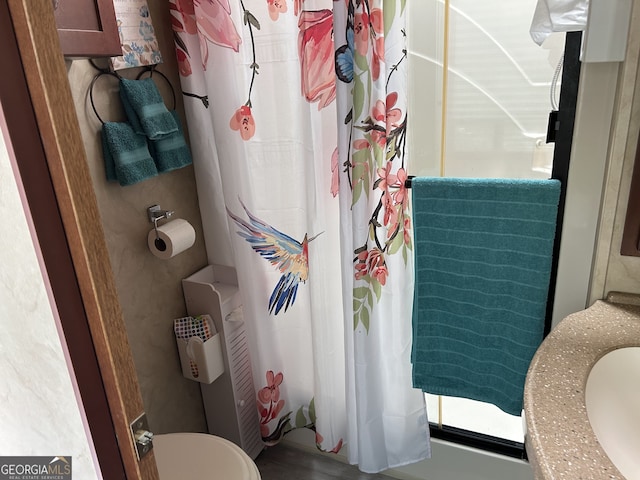 bathroom featuring curtained shower