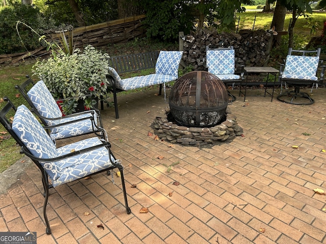 view of patio / terrace with an outdoor fire pit