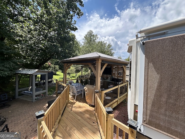 wooden deck featuring a gazebo