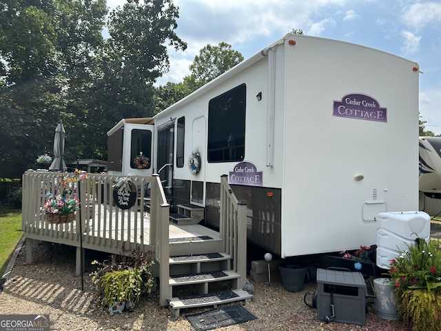 rear view of property with a deck