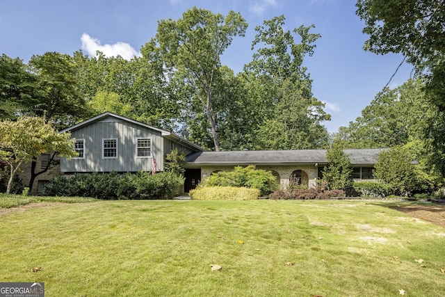 split level home with a front yard