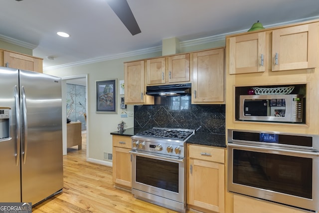 kitchen with stainless steel appliances, light hardwood / wood-style floors, and light brown cabinets