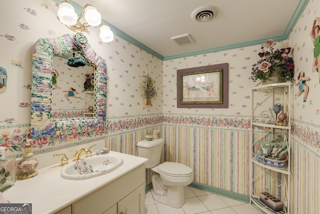 bathroom featuring toilet, vanity, and tile patterned floors