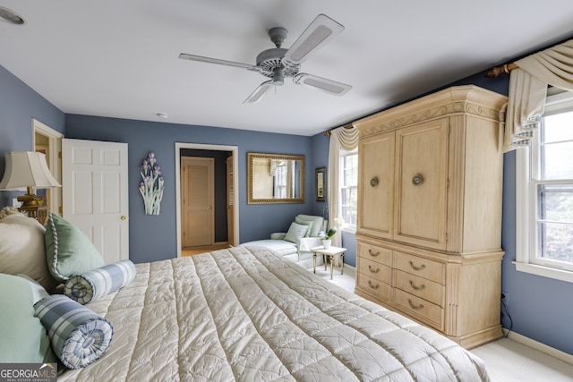 carpeted bedroom featuring ceiling fan