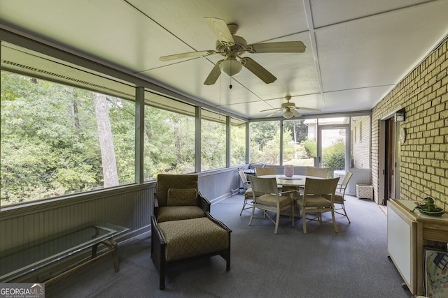 sunroom / solarium with ceiling fan