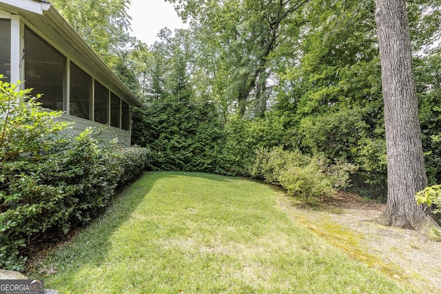 view of yard featuring a sunroom