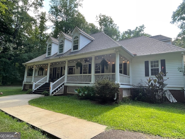 cape cod house with a front lawn and covered porch