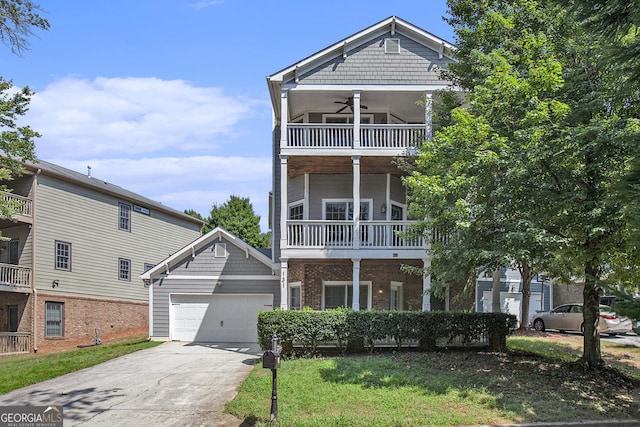 view of front of house featuring a balcony and ceiling fan
