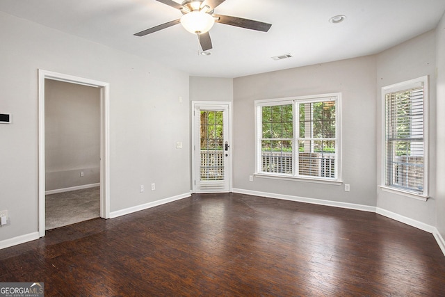 spare room with ceiling fan and dark hardwood / wood-style floors