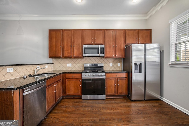 kitchen featuring ornamental molding, sink, stainless steel appliances, and dark wood-type flooring