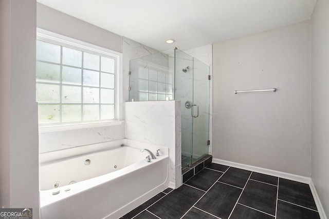 bathroom featuring tile patterned floors and separate shower and tub